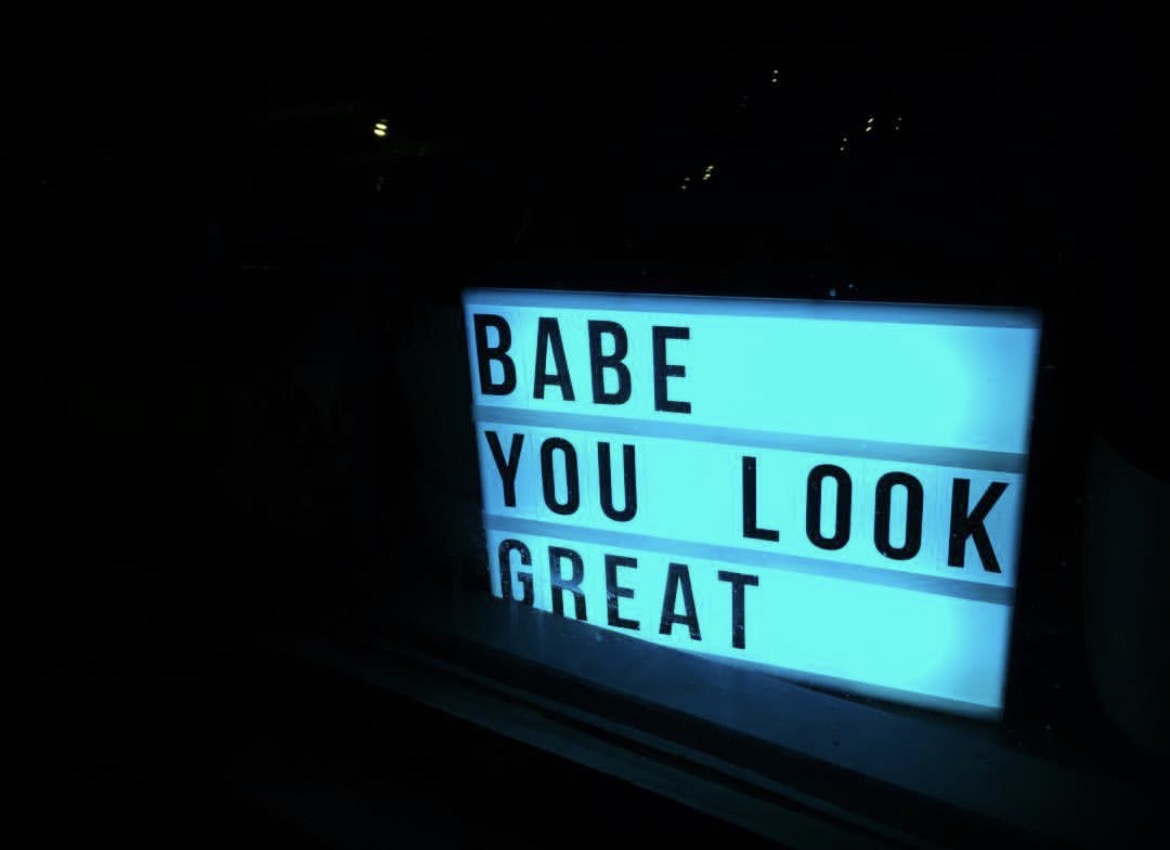 Blue light box reading Babe, you look great